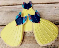 Beautiful Snow White princess dress iced cookie with yellow skirt and blue bodice