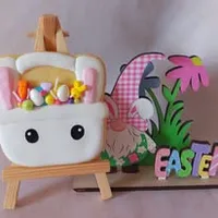 Cute Easter basket iced cookie filled with colorful eggs and decorated with bunny ears